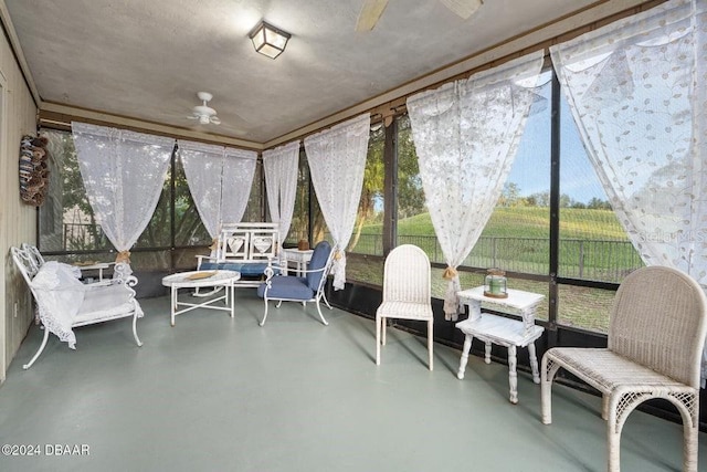 sunroom with a ceiling fan