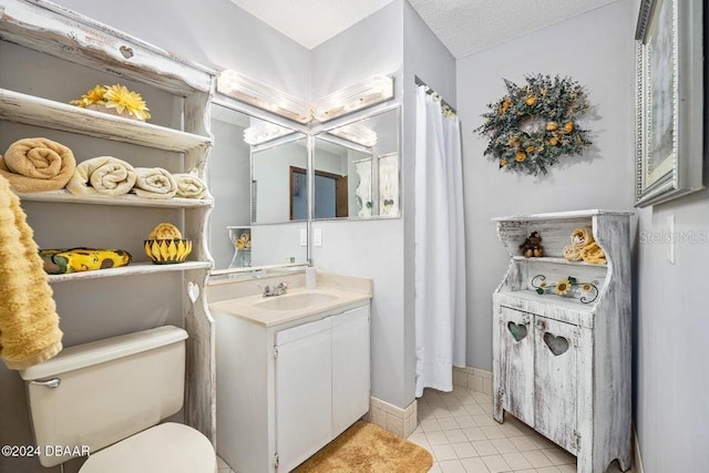 full bathroom featuring tile patterned floors, baseboards, toilet, and vanity