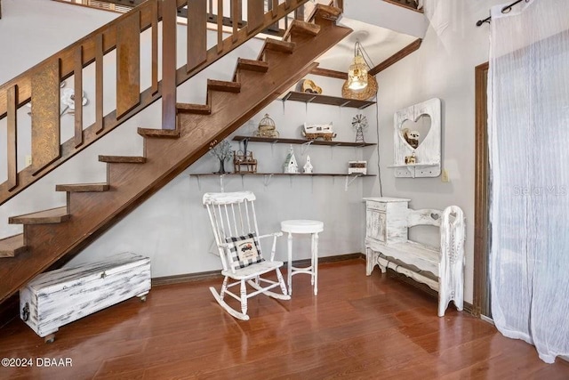 bar with stairs, crown molding, baseboards, and wood finished floors