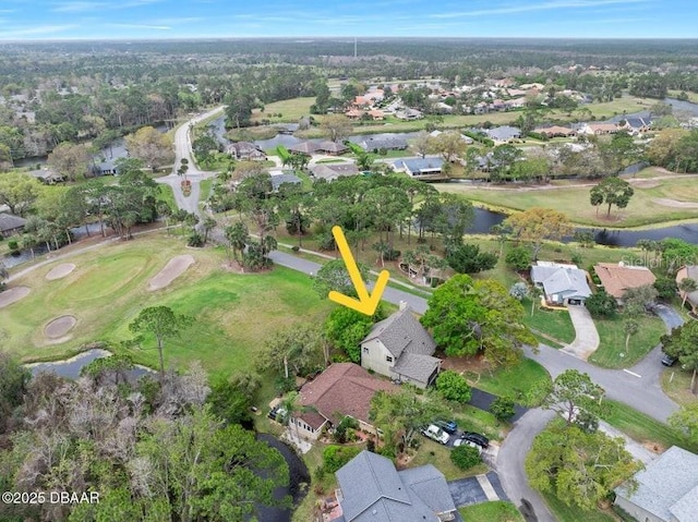 bird's eye view with a residential view and a water view