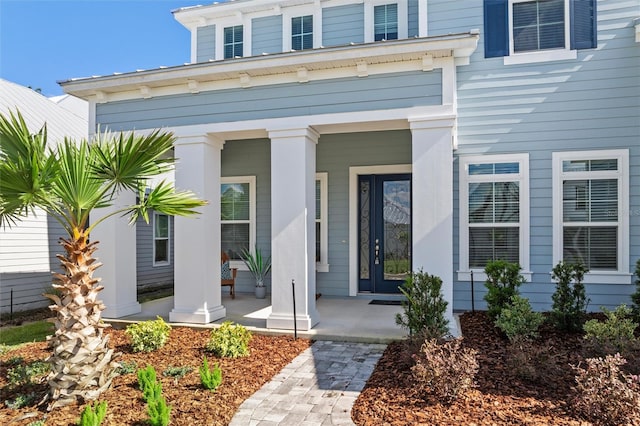 doorway to property featuring a porch