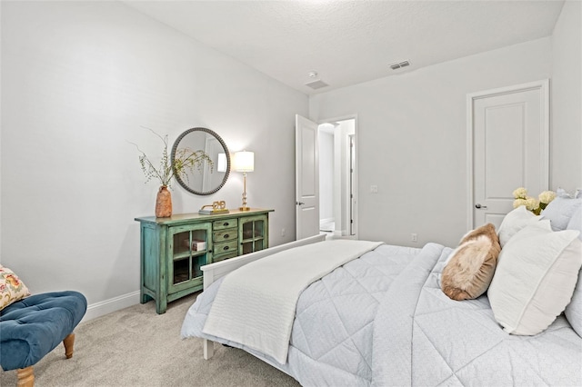 bedroom featuring light colored carpet