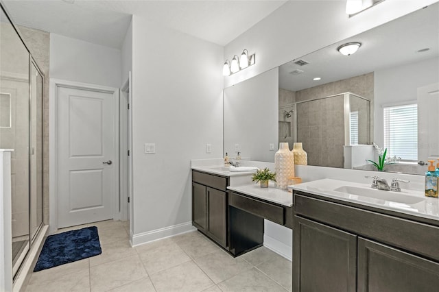 bathroom with vanity, tile patterned floors, and a shower with shower door