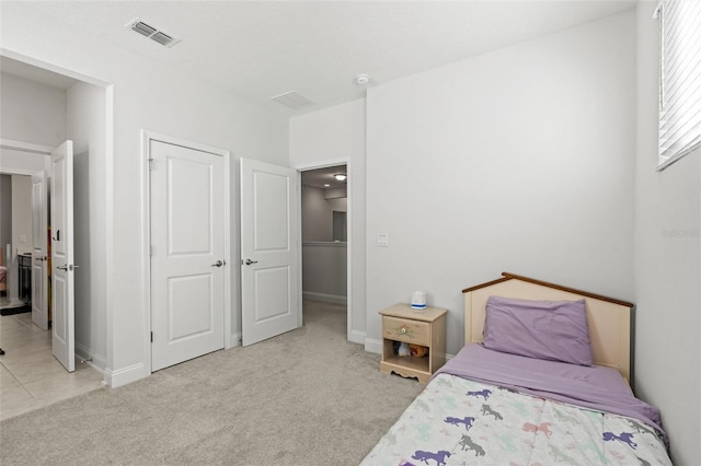 carpeted bedroom featuring a closet