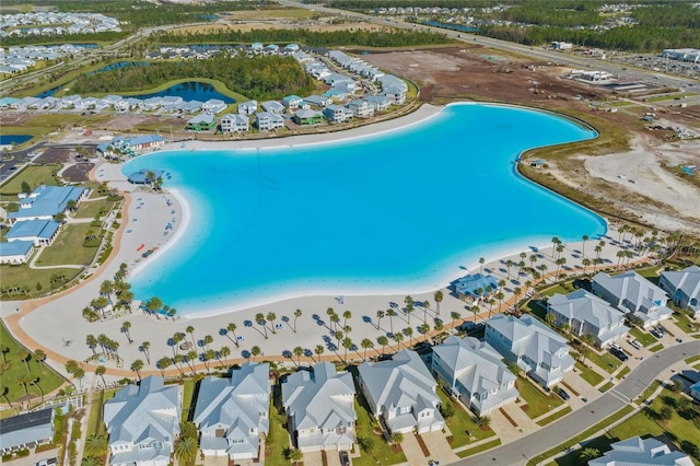 bird's eye view with a view of the beach and a water view