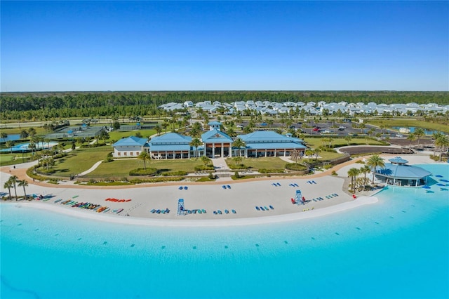 drone / aerial view featuring a water view and a beach view