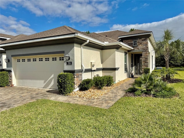 view of front of home featuring a garage and a front lawn