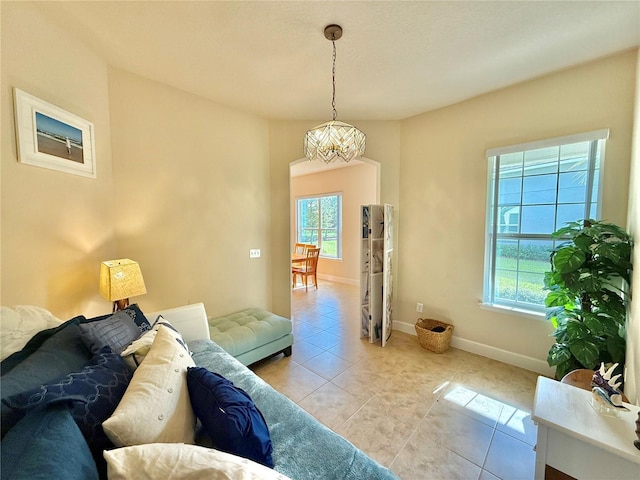 tiled living room featuring a wealth of natural light