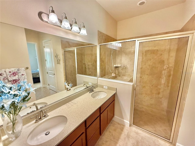 bathroom with vanity, tile patterned floors, and a shower with door