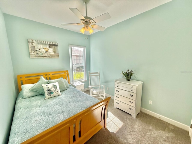 bedroom featuring ceiling fan and light colored carpet