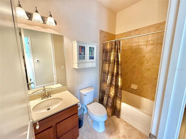 full bathroom featuring tile patterned floors, shower / bath combo with shower curtain, vanity, and toilet