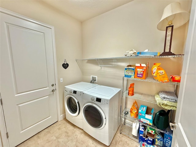 laundry room with separate washer and dryer