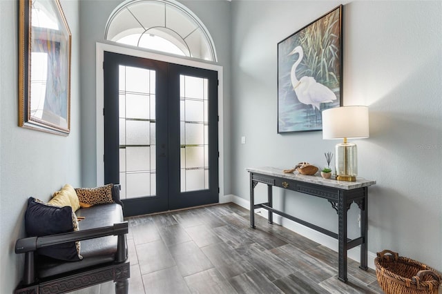 entryway featuring dark hardwood / wood-style flooring and french doors