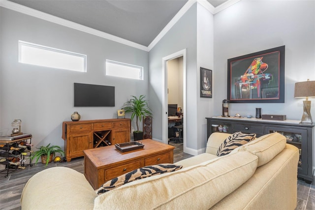 living room featuring lofted ceiling, dark wood-type flooring, and ornamental molding