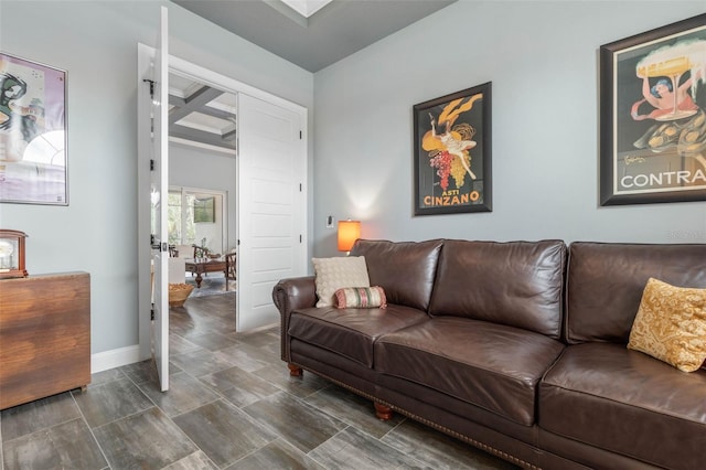 living room featuring beam ceiling and coffered ceiling