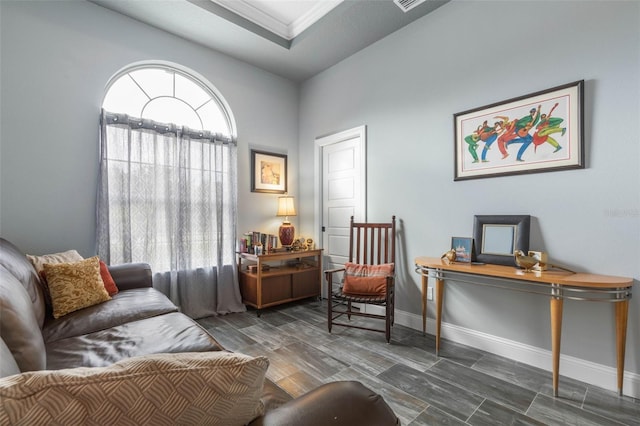 sitting room with lofted ceiling and dark wood-type flooring