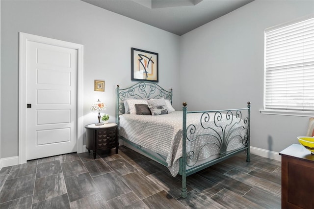 bedroom featuring dark wood-type flooring