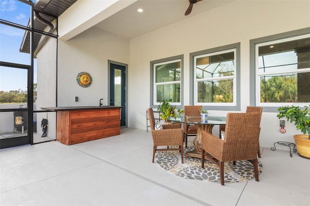 sunroom / solarium featuring beam ceiling