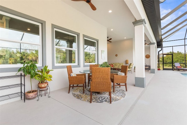 view of patio / terrace with glass enclosure and ceiling fan