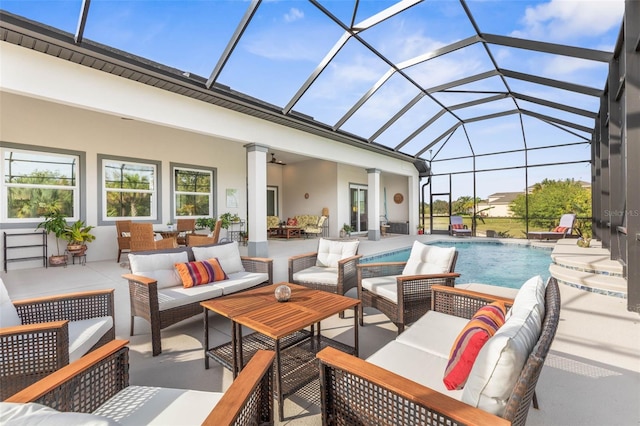 exterior space featuring an outdoor hangout area, glass enclosure, and ceiling fan