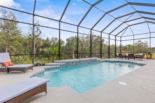 view of pool featuring a patio area and a lanai