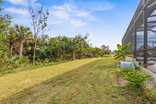 view of yard with a lanai