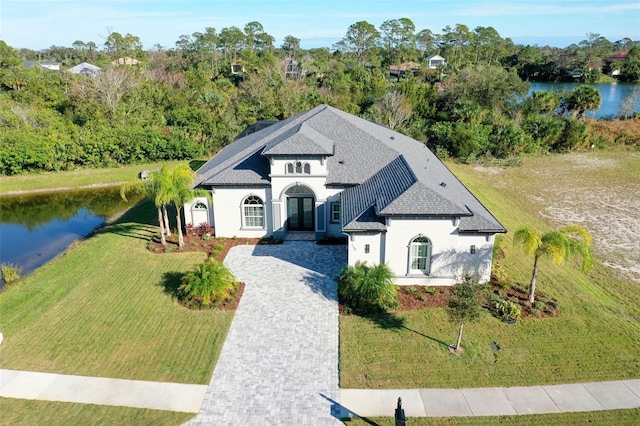 view of front of property with a water view and a front yard