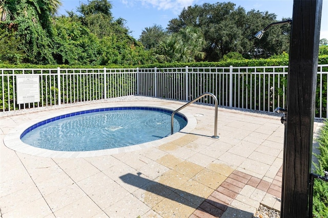 view of swimming pool with a patio area