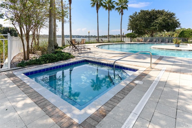 view of swimming pool featuring a patio area