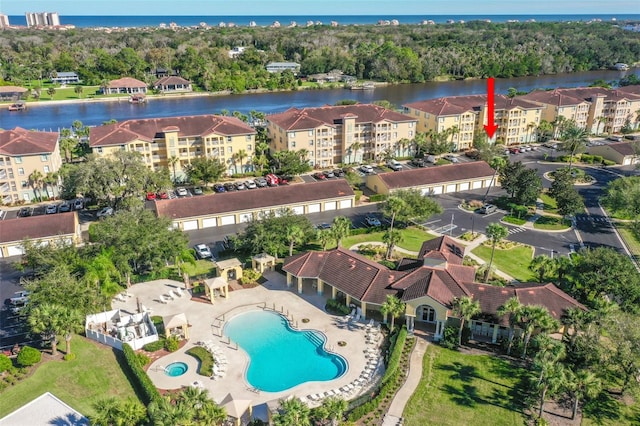 birds eye view of property with a water view