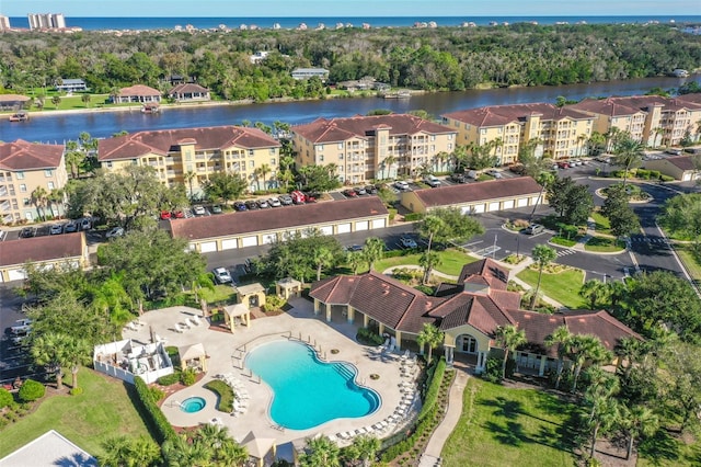 birds eye view of property with a water view