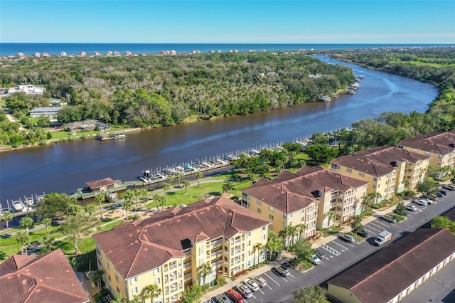 birds eye view of property featuring a water view