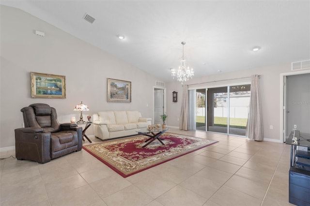 living room with a notable chandelier, lofted ceiling, and light tile patterned flooring