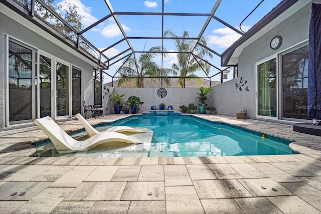 view of pool with a lanai and a patio