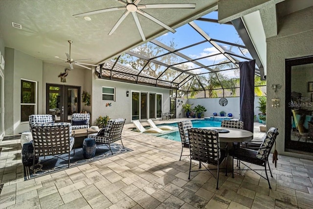 view of patio featuring french doors, an outdoor living space, a fenced in pool, and glass enclosure