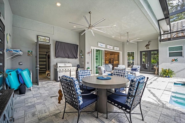 dining space featuring a textured ceiling and french doors