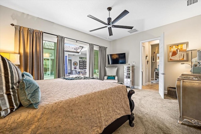 bedroom featuring ceiling fan, light carpet, and connected bathroom