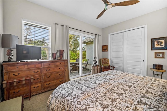 bedroom with ceiling fan, access to exterior, light carpet, and a closet