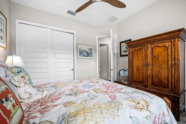 bedroom with ceiling fan and a closet