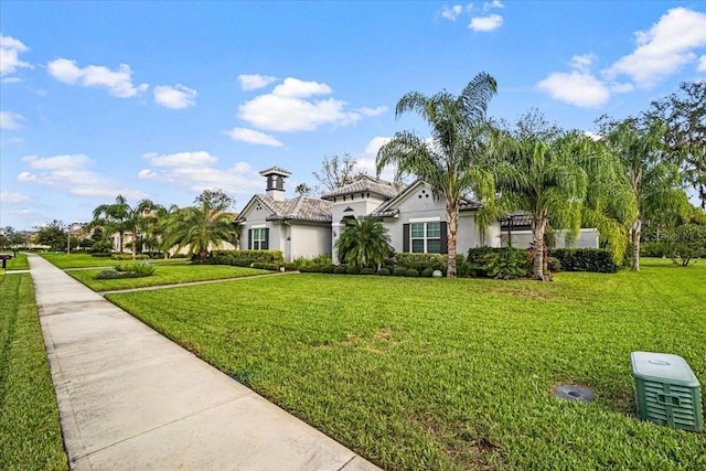 view of front of property with a front lawn