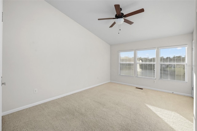 unfurnished room with light carpet, ceiling fan, and lofted ceiling