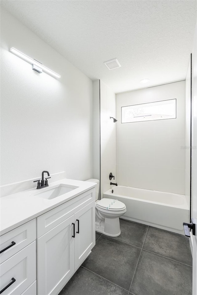 34 Bannbury Ln, Palm Coast, FL 32137 - full bathroom with tile patterned floors, tub / shower combination, vanity, a textured ceiling, and toilet