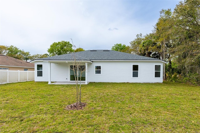 34 Bannbury Ln, Palm Coast, FL 32137 - rear view of property featuring a lawn and a patio area