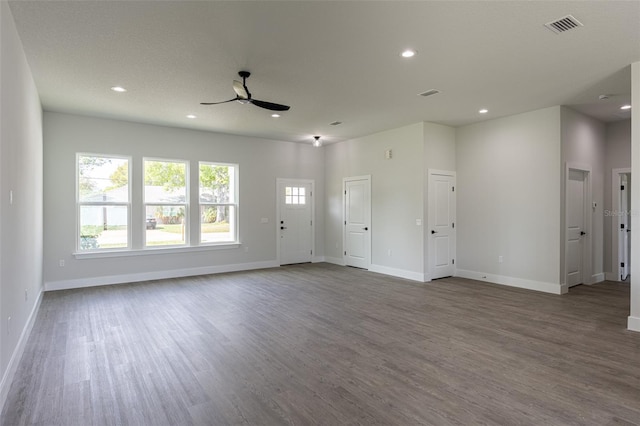 unfurnished living room with hardwood / wood-style floors and ceiling fan