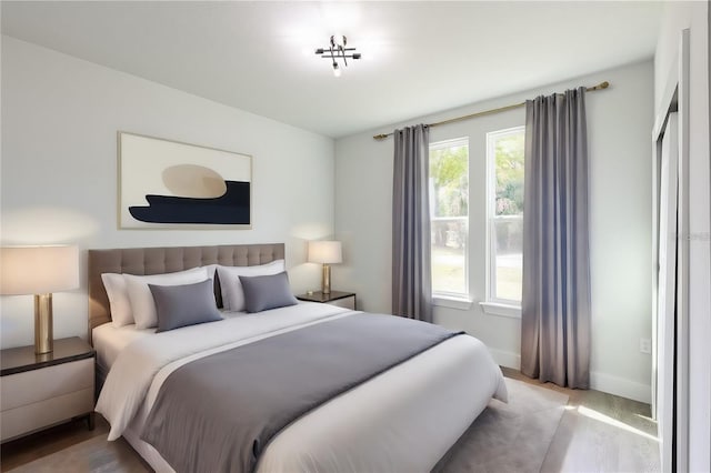 bedroom with light hardwood / wood-style floors