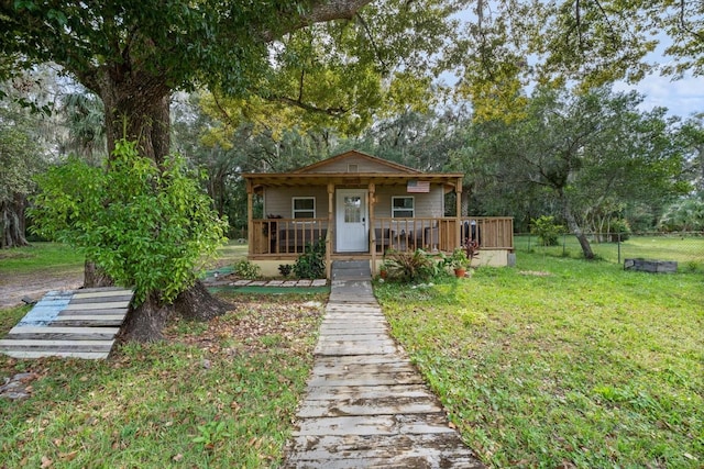 bungalow-style house featuring a front yard