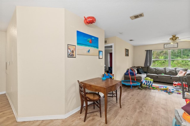 playroom with ceiling fan and light wood-type flooring