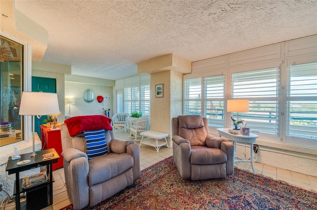 tiled living room featuring plenty of natural light and a textured ceiling