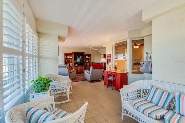 tiled living room with a textured ceiling