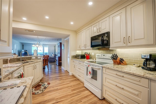 kitchen featuring pendant lighting, white range with electric stovetop, decorative backsplash, a notable chandelier, and light hardwood / wood-style floors